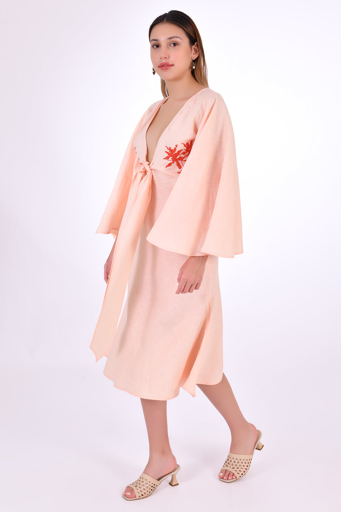 Fanm Mon Dayna Linen Dress Side View. Showcasing Kimono Sleeve, Embroidery detail, Plunging Neckline with Tie Front, and length.