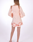Fanm Mon Gizem Linen Mini Dress, showcasing back view with open shoulder detail and embroidery on hem. 