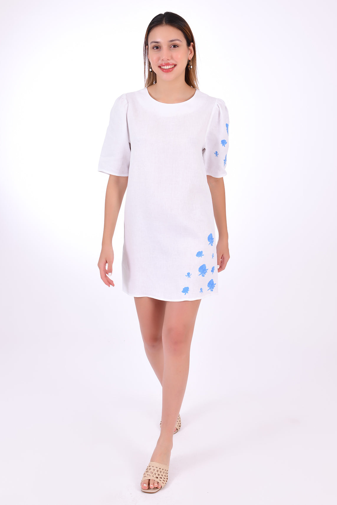 Fanm Mon Deniz Linen Dress Front View. Mini Linen Dress. Featuring a peephole open back and button closure. Round neck, with belted detail at the waist and on sleeves with front embroidery pattern.