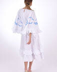 Fanm Mon Hati Midi Linen Dress, showcasing key hole closer, bell sleeves and wrap around embroidery detail. Back View.