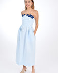 Fanm Mon Linen Lorr Dress in Light Lagoon, flaunts a sheath strapless silhouette embellished with hand-embroidered floral appliques in harmonizing hues along the neckline. Front View.  