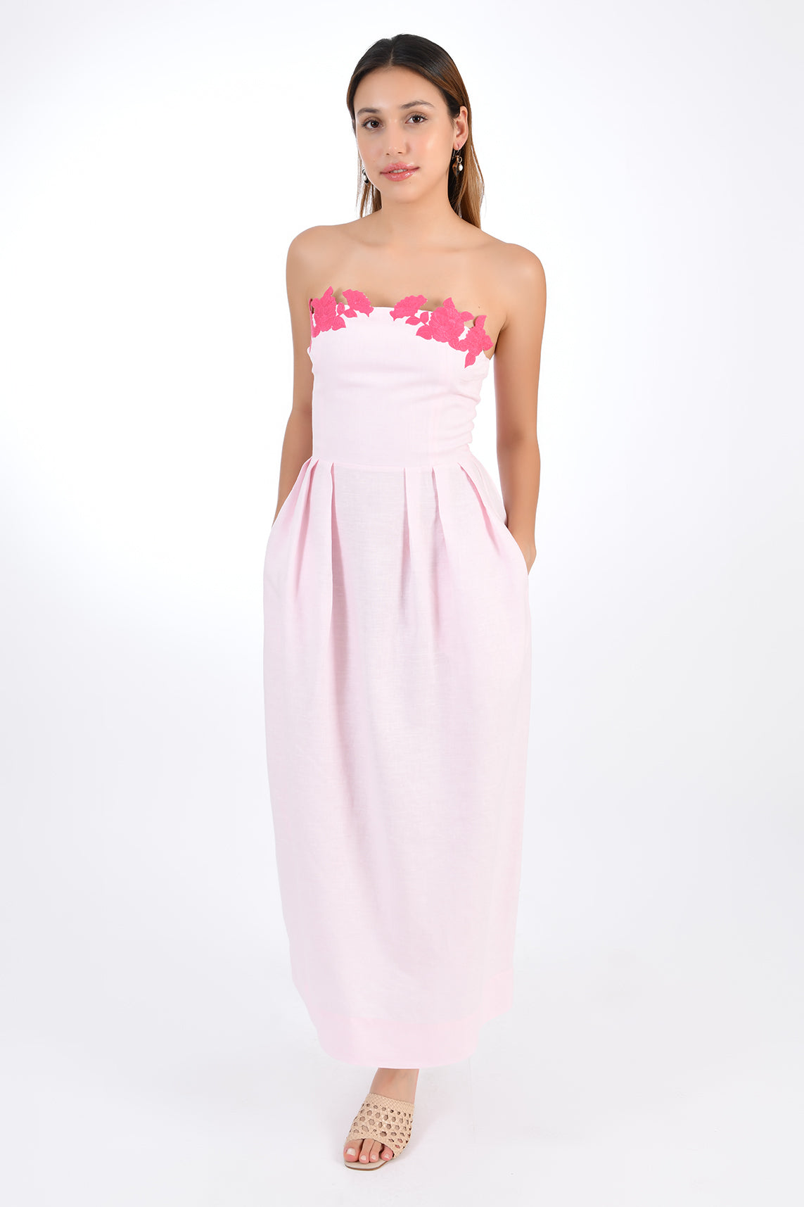 Fanm Mon Linen Lorr Midi Dress in Light pink, showcasing hand-embroidered floral appliques in harmonizing hues along the neckline. Front View.