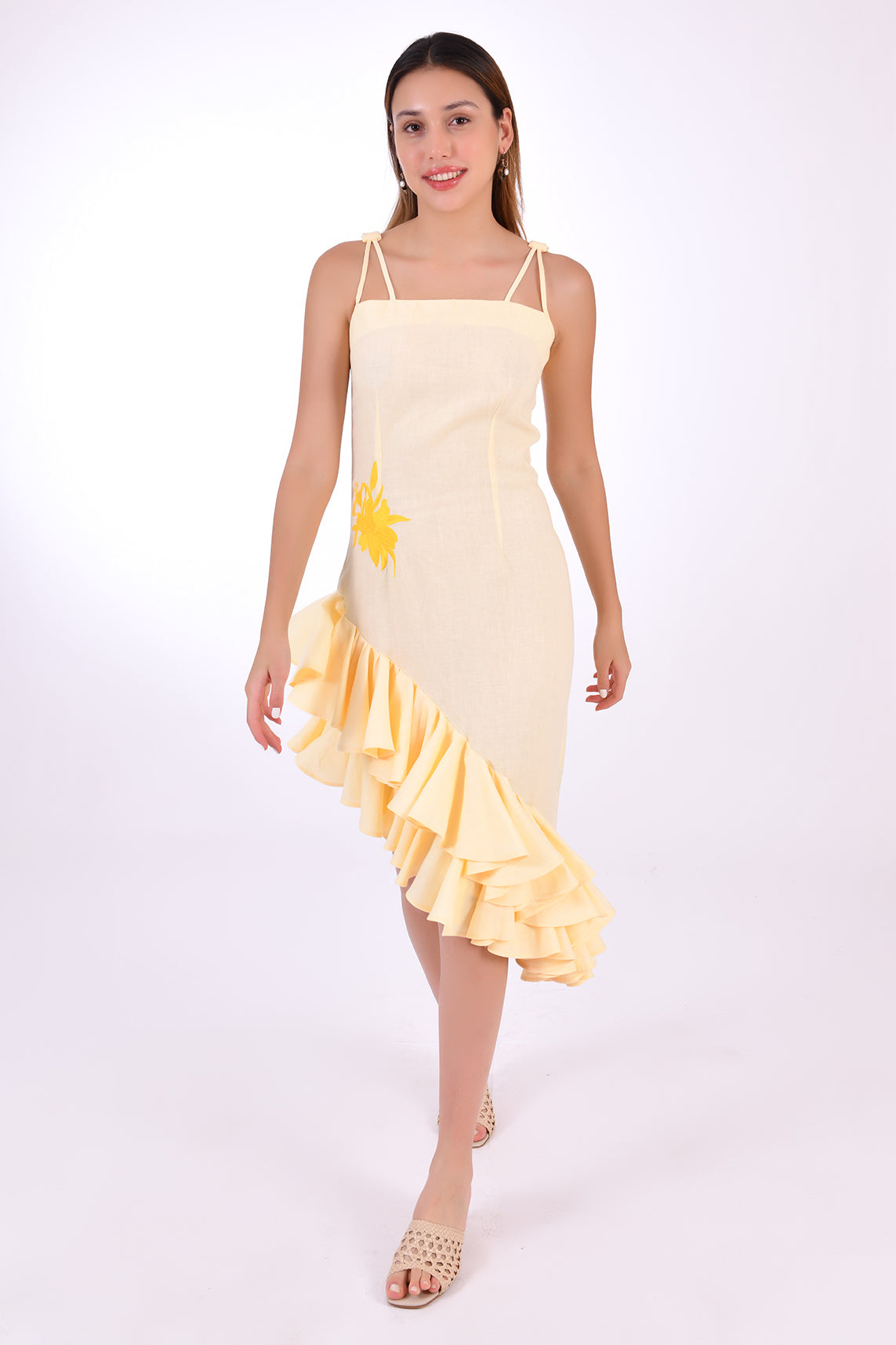 Fanm Mon Freda Midi Linen Dress, Made to Measure. Showing movement and  with flared asymmetrical ruffled hemline. (Front View)
