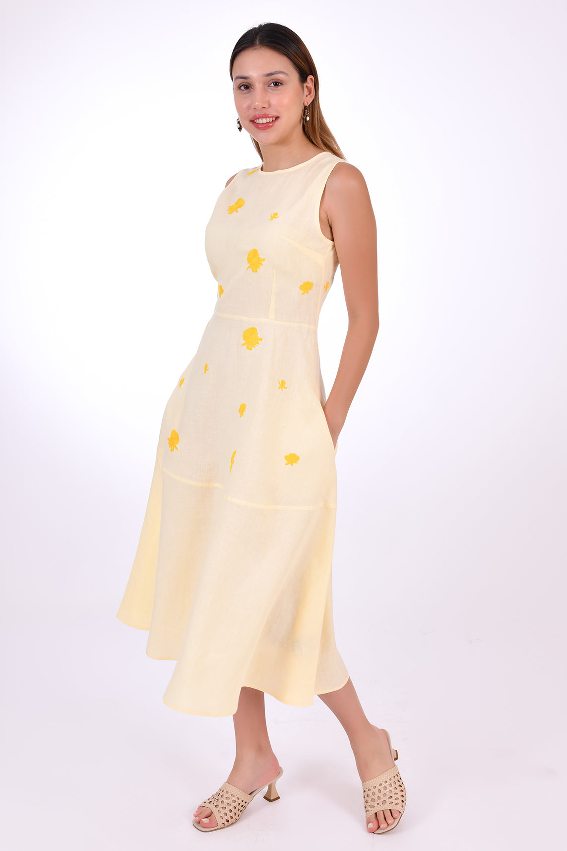 Fanm Mon Elvan Linen Dress, Made to Measure. SIde view showcasing pockets and floral embroidery detail.