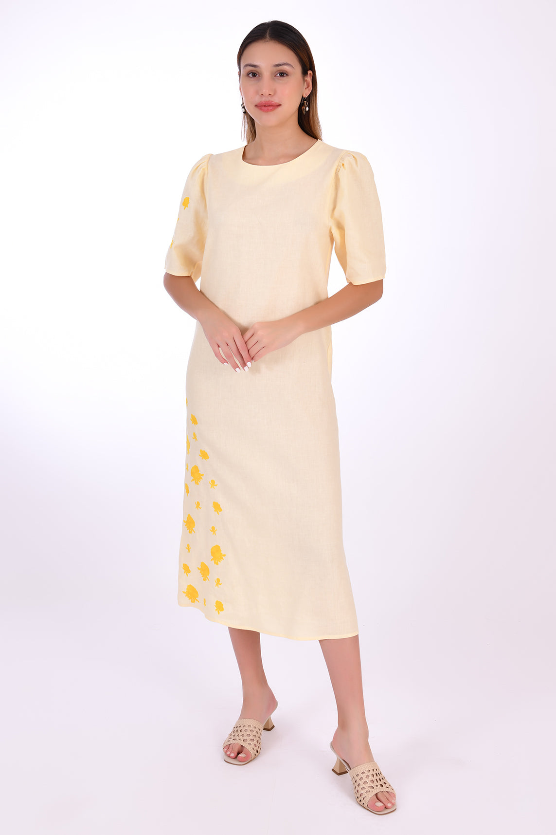 Doga Midi Linen Dress, Front View. Featuring a peephole open back and button closure. Round neck, with a belt for the waist (can be worn with or without), and features front embroidery detail. 
