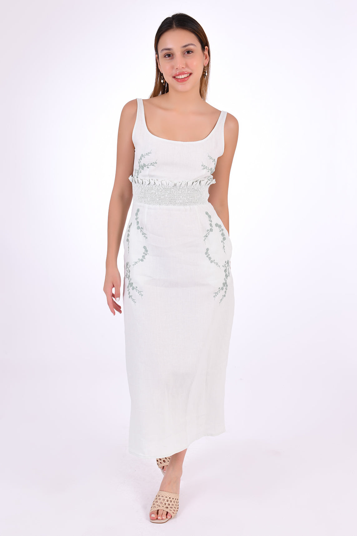 Fanm Mon BAHAR Midi Dress alternative front view. Sleeveless Midi Linen Sheath Dress. Featuring a smocked waistband with ruffle trim and hand-embroidered floral pattern.