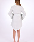 Fanm Mon Boze Dress Back View. Kaftan Style Linen Dress with wide kimono embroidered sleeves and handkerchief hem and tie front.  Easy slip-on wear,  mini length loose fit dress. 