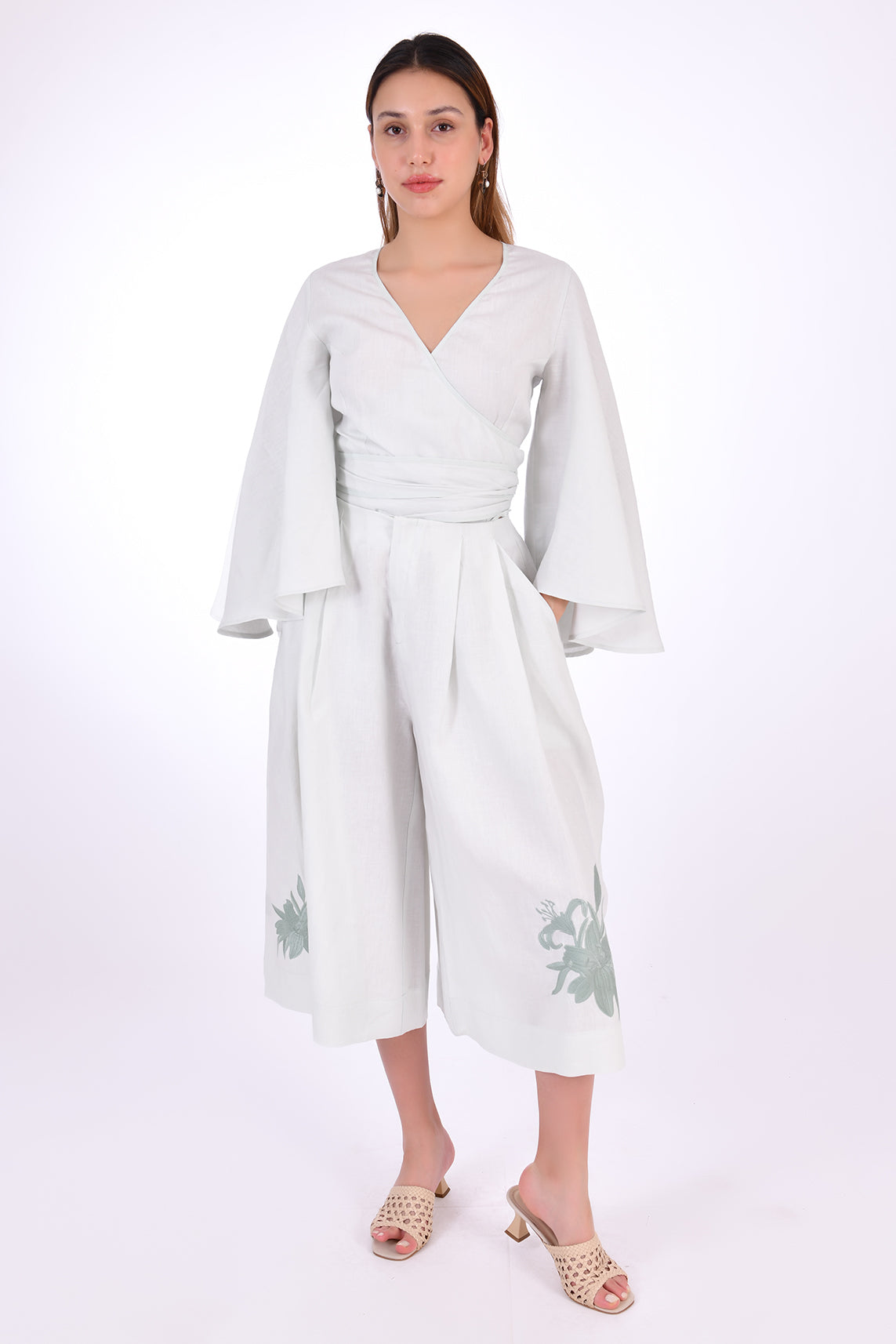 Fanm Mon Des-Vu Linen Shorts Set (Front View). 2-Piece Linen Shorts & Top Set. Featuring a wrap top with wide long sleeves and long pleated shorts with embroidery.