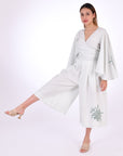 Fanm Mon Des-Vu Linen Shorts Set (Alt. Front View). 2-Piece Linen Shorts & Top Set. Featuring a wrap top with wide long sleeves and long pleated shorts with embroidery.